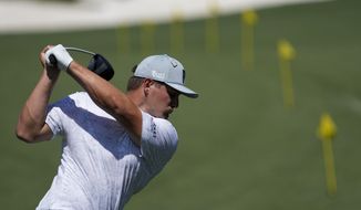 Bryson DeChambeau warms up on the range before a practice round for the Masters golf tournament on Monday, April 5, 2021, in Augusta, Ga. (AP Photo/David J. Phillip)