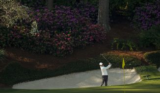 Rory McIlroy, of Northern Ireland, hits from the bunker on the 13th hole during a practice round for the Masters golf tournament on Tuesday, April 6, 2021, in Augusta, Ga. (AP Photo/David J. Phillip)