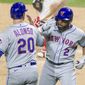 New York Mets Dominic Smith (2) celebrates with Pete Alonso (20) after hitting a two run homer during the fourth inning of a baseball game against the Philadelphia Phillies, Tuesday, April 6, 2021, in Philadelphia. (AP Photo/Laurence Kesterson)