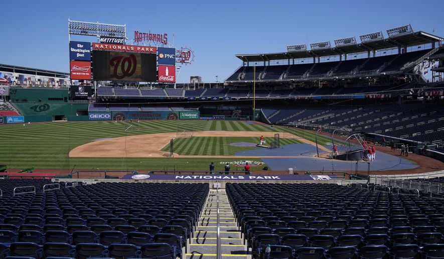 The Washington Nationals have a baseball workout at Nationals Park, Monday, April 5, 2021, in Washington. The Nationals had a conronavirus outbreak that sidelined 11 players, four of whom tested positive for COVID-19, and delayed their first game until Tuesday. (AP Photo/Alex Brandon)