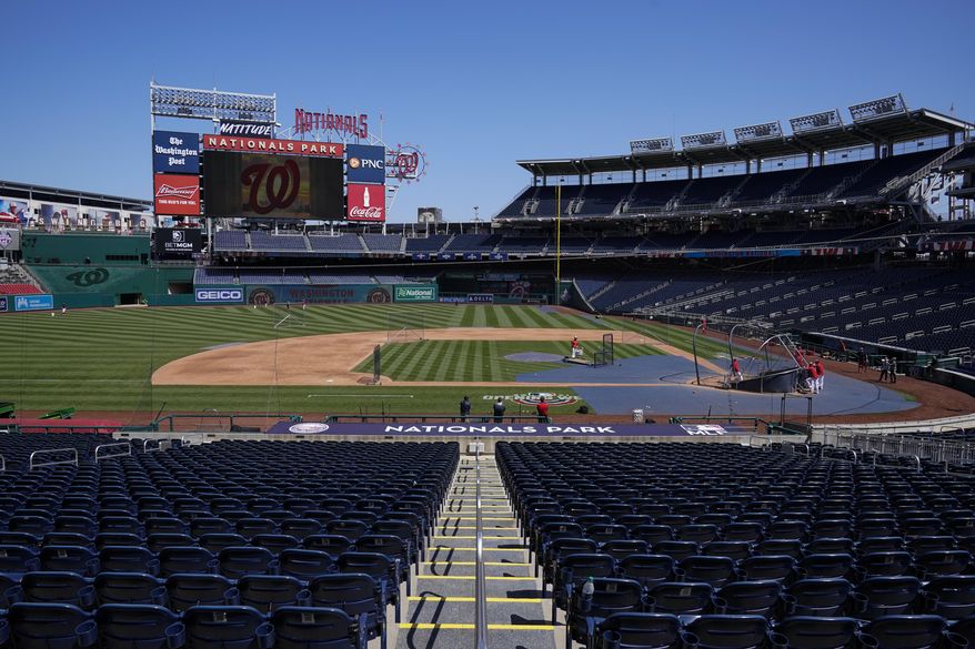 The Washington Nationals have a baseball workout at Nationals Park, Monday, April 5, 2021, in Washington. The Nationals had a conronavirus outbreak that sidelined 11 players, four of whom tested positive for COVID-19, and delayed their first game until Tuesday. (AP Photo/Alex Brandon)