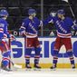 New York Rangers&#39; Pavel Buchnevich, right, celebrates his third-period goal against the Pittsburgh Penguins with Libor Hajek, left, and Filip Chytil (72 during an NHL hockey game Tuesday, April 6, 2021, in New York. (Bruce Bennett/Pool Photo via AP)