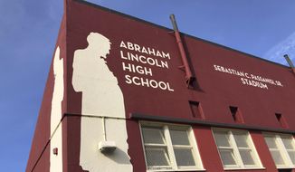 Abraham Lincoln High School is seen in San Francisco, on Jan. 27, 2021. The embattled San Francisco school board is poised to reverse a decision to rename 44 schools in an effort to avoid costly litigation and tone down national criticism. In a Tuesday, April 6, 2021, meeting, the board will vote on a resolution to rescind a controversial January decision to rename schools and revisit the matter after all students have returned full-time to in-person learning. (AP Photo/Haven Daley)