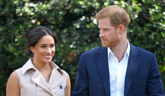 In this Oct. 2, 2019, file photo, Britain&#39;s Prince Harry and Meghan Markle appear at the Creative Industries and Business Reception at the British High Commissioner&#39;s residence in Johannesburg. (Dominic Lipinski/Pool via AP, File)