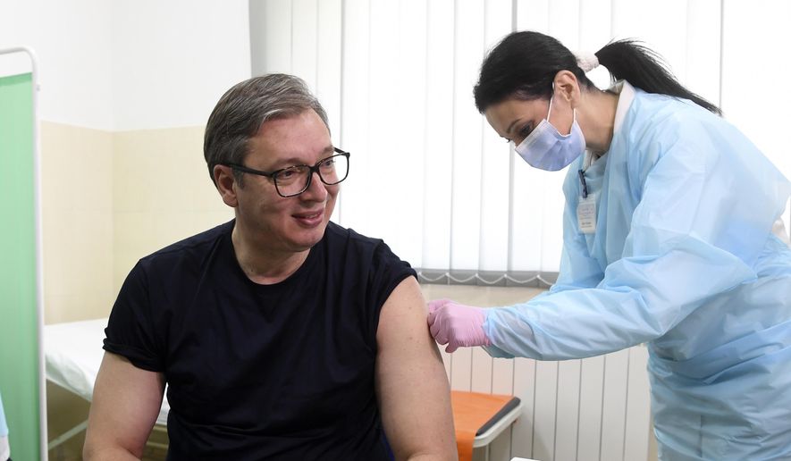 In this photo provided by the Serbian Presidential Press Service, Serbian President Aleksandar Vucic receives a dose of the Chinese Sinopharm vaccine in the village of Rudna Glava, Serbia, Tuesday, April 6, 2021. Vucic finally rolled up his sleeve for a coronavirus vaccine Tuesday and to encourage his country&#39;s increasingly skeptical Serbs to get vaccinated themselves. (Serbian Presidential Press Service via AP)
