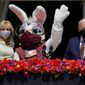 President Joe Biden appears with first lady Jill Biden and the Easter Bunny on the Blue Room balcony at the White House, Monday, April 5, 2021, in Washington. The annual Easter egg Roll at the White House was canceled due to the ongoing pandemic. (AP Photo/Evan Vucci)