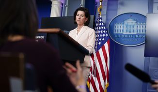 Commerce Secretary Gina Raimondo listens to a question during a press briefing at the White House, Wednesday, April 7, 2021, in Washington. (AP Photo/Evan Vucci)
