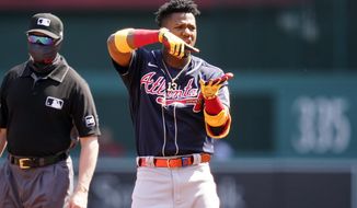 Atlanta Braves&#39; Ronald Acuna Jr. celebrates his double during the first inning in the first baseball game of a doubleheader against the Washington Nationals at Nationals Park, Wednesday, April 7, 2021, in Washington. (AP Photo/Alex Brandon)