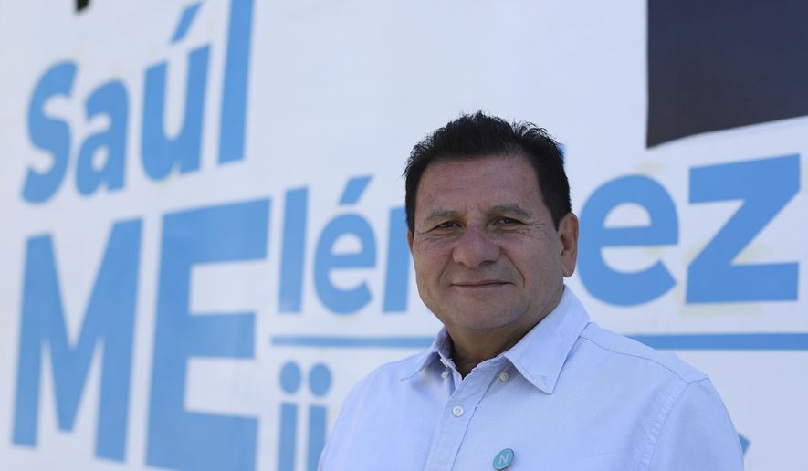 Former guerrilla fighter Saul Melendez poses for a photo outside the New Ideas party's Campaign House in Mejicanos, El Salvador, Sunday, April 4, 2021. Melendez was for years a loyal member of the leftist Farabundo Martí National Liberation Front party, but at the end of February, he won his first elected office as a member of President Nayib Bukele’s New Ideas party. (AP Photo/Salvador Melendez)
