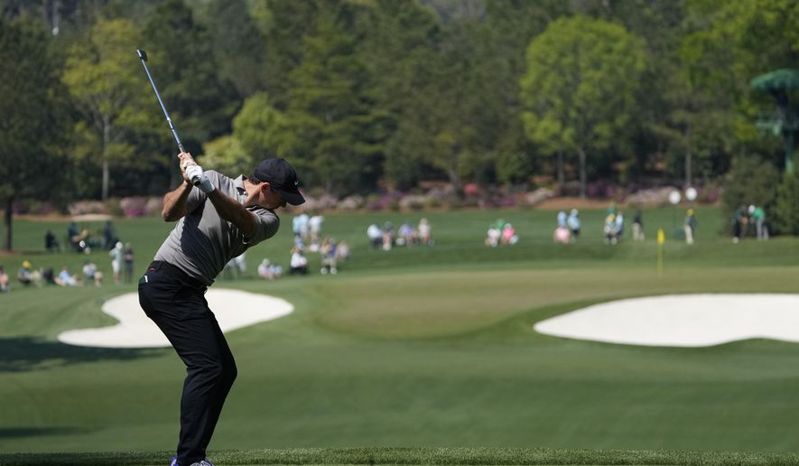Rory McIlroy, of Northern Ireland, tees off on the fourth hole during a practice round for the Masters golf tournament on Wednesday, April 7, 2021, in Augusta, Ga. (AP Photo/Gregory Bull)