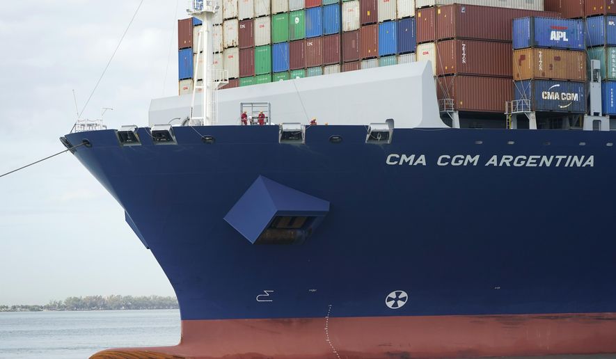 Crew members stand on the bow as the CMA CGM Argentina arrives at PortMiami, the largest container ship to call at a Florida port, Tuesday, April 6, 2021, in Miami.  The U.S. trade deficit grew to $71.1 billion in February, as a decline in exports more than offset a slight dip in imports. The February gap between what America buys from abroad compared to what it sells abroad jumped 4.8% the revised January deficit of $67.8 billion.vThe increase reflected a 2.6% decline in exports of goods and services to $187.3 billion on a seasonally adjusted basis. (AP Photo/Lynne Sladky)