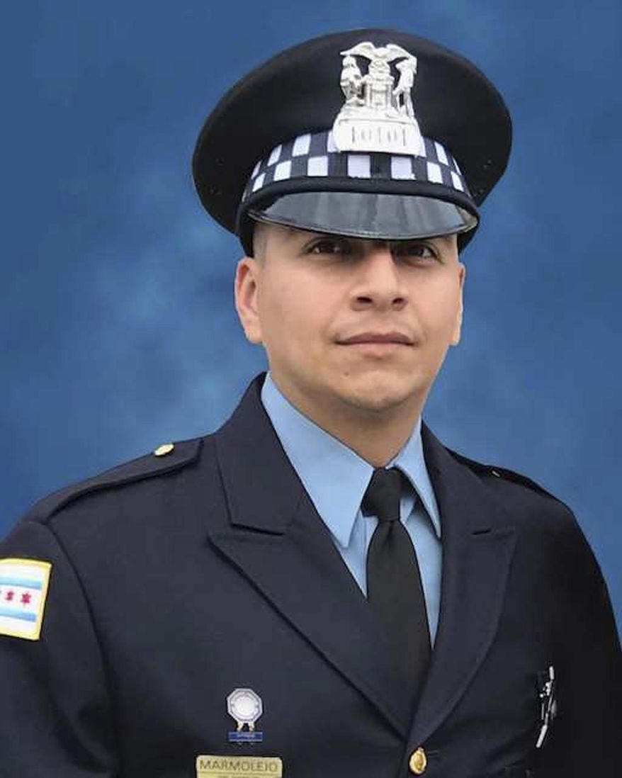 FILE - This undated file photo provided by the Chicago Police Department shows Chicago Police Officer Eduardo Marmolejo. Edward Brown, who fired a gun in 2018 that prompted Marmolejo and fellow Officer Conrad Gary to venture onto railroad tracks where they were fatally struck by a train, pleaded guilty Wednesday, April 7, 2021, to unlawful use of a weapon. (Chicago Police Department via AP, File)