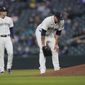 Seattle Mariners starting pitcher James Paxton, right, reacts near the mound after experiencing an injury during the second inning of a baseball game against the Chicago White Sox, Tuesday, April 6, 2021, in Seattle. Paxton left the game and the White Sox won 10-4. (AP Photo/Ted S. Warren)