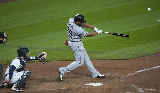 Chicago White Sox&#39;s Jose Abreu hits a grand slam during the eighth inning of the team&#39;s baseball game against the Seattle Mariners, Tuesday, April 6, 2021, in Seattle. (AP Photo/Ted S. Warren)