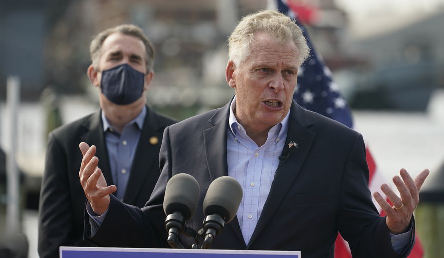 Former Virginia Gov. Terry McAuliffe, right, gestures during a news conference with Virginia Gov. Ralph Northam, left, at Waterside in Norfolk, Va., Thursday, April 8, 2021. Northam endorsed McAuliffe for governor. (AP Photo/Steve Helber) ** FILE **