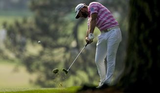 Dustin Johnson hits on the first fairway during the first round of the Masters golf tournament on Thursday, April 8, 2021, in Augusta, Ga. (AP Photo/Matt Slocum)