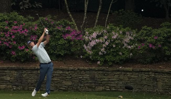 Justin Rose, of England, tees off on the 12th hole during the first round of the Masters golf tournament on Thursday, April 8, 2021, in Augusta, Ga. (AP Photo/Charlie Riedel)