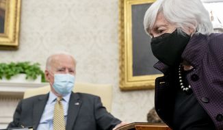 President Joe Biden, accompanied by Treasury Secretary Janet Yellen, right, speaks as he gets his weekly economic briefing in the Oval Office of the White House, Friday, April 9, 2021, in Washington. (AP Photo/Andrew Harnik) **FILE**