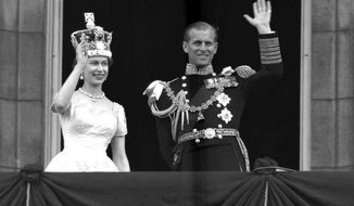 FILE - In this June 2, 1953 file photo, Britain&#39;s Queen Elizabeth II and her husband, the Duke of Edinburgh, wave from the balcony of Buckingham Palace, London, following the Queen&#39;s coronation at Westminster Abbey. Buckingham Palace says Prince Philip, husband of Queen Elizabeth II, has died aged 99. (AP Photo/Leslie Priest, File)