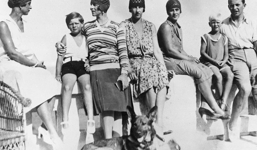 FILE - In this Sept. 8, 1928 file photo, Romania&#39;s King Michael, second left, with his mother, Princess Helene, enjoy a holiday at Mamaia, Romania. From left, Princess Fedora of Greece, King Michael, Princess Helene, Princess Irene of Greece, Princess Marguerite of Greece, Prince Philip of Greece and Prince Paul of Greece.  Prince Philip was born into the Greek royal family but spent almost all of his life as a pillar of the British one. His path was forged when he married the heir to the British throne, and a promising naval career was cut short when his wife suddenly became Queen Elizabeth II. Nevertheless, he set about forging a place for himself as royal consort. He was a patron of charities and a supporter of projects for young people. He was married for more than 73 years and was still carrying out royal engagements into his late 90s. (AP Photo/File)