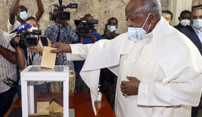 Djibouti&#x27;s President Ismael Omar Guelleh casts his vote in the capital Djibouti city, Djibouti Friday, April 9, 2021. The Horn of Africa country of Djibouti is going to the polls on Friday as President Ismail Omar Guelleh seeks a fifth term in the small but strategically important nation home to military bases for the United States, China and others. (AP Photo)