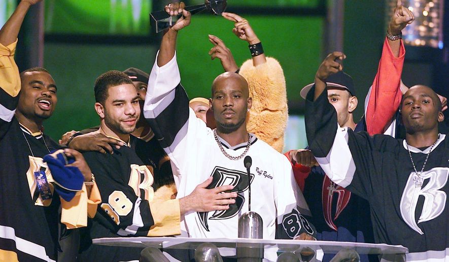 FILE - DMX, center, accepts the R&amp;amp;B Album Artist of the Year during the 1999 Billboard Music Awards in Las Vegas, on Dec. 8, 1999. The family of rapper DMX says he has died at age 50 after a career in which he delivered iconic hip-hop songs such as “Ruff Ryders’ Anthem.&amp;quot; A statement from the family says the Grammy-nominated rapper died at a hospital in White Plains, New York, &amp;quot;with his family by his side&amp;quot; after being placed on life support for the past few days. He was rushed to a New York hospital from his home April 2. (AP Photo/Laura Rauch, File)