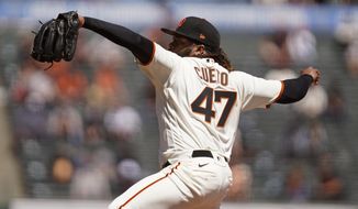 San Francisco Giants starting pitcher Johnny Cueto works in the first inning of a baseball game against the Colorado Rockies, Friday, April 9, 2021, in San Francisco. (AP Photo/Eric Risberg)