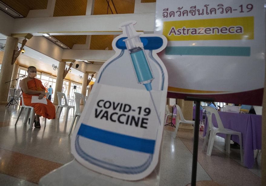 A Buddhist monk waits to receive a dose of the Astrazeneca COVID-19 vaccine at Nak Prok Temple in Bangkok, Thailand, Friday, April 9, 2021. (AP Photo/Sakchai Lalit)