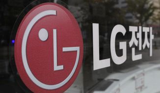 FILE - This Oct. 26, 2017 file photo shows the corporate logo of LG Electronics in Goyang, South Korea. Two South Korean electric vehicle battery makers have settled a long-running trade dispute that will allow one of them to move ahead with plans to make batteries in Georgia. That&#x27;s according to a person briefed on the matter. The person says LG Energy Solution and SK Innovation reached the settlement, ending the need for President Joe Biden to intervene.(AP Photo/Lee Jin-man, File)