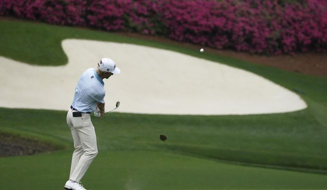 Will Zalatoris chips to the 13th green during the third round of the Masters golf tournament on Saturday, April 10, 2021, in Augusta, Ga. (AP Photo/Charlie Riedel)