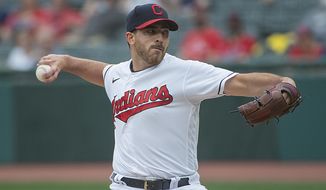 Cleveland Indians starting pitcher Aaron Civale delivers to a Detroit Tigers batter during the first inning of a baseball game in Cleveland, Saturday, April 10, 2021. (AP Photo/Phil Long)