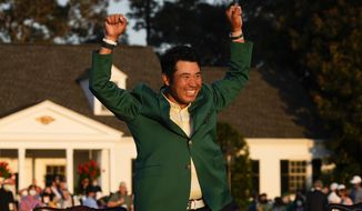 Hideki Matsuyama, of Japan, celebrates during champion&#39;s green jacket ceremony after winning the Masters golf tournament on Sunday, April 11, 2021, in Augusta, Ga. (AP Photo/David J. Phillip)