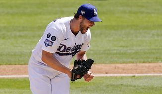 Los Angeles Dodgers starting pitcher Clayton Kershaw celebrates after striking out Washington Nationals&#39; Jordy Mercer to end the top of the sixth inning of a baseball game Sunday, April 11, 2021, in Los Angeles. (AP Photo/Mark J. Terrill)