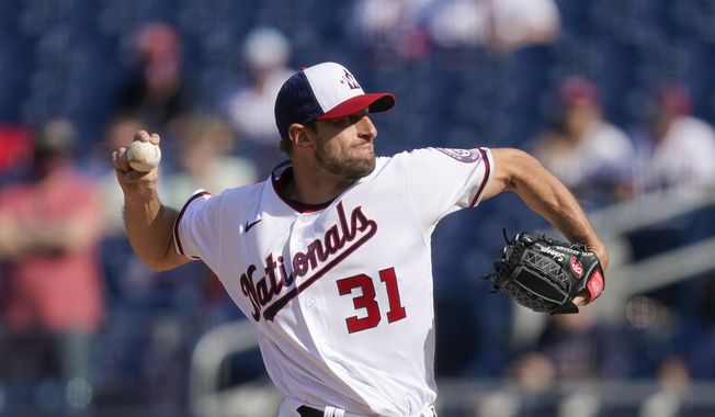 Washington Nationals starting pitcher Max Scherzer throws to the Atlanta Braves in the first inning of an opening day baseball game at Nationals Park, Tuesday, April 6, 2021, in Washington. (AP Photo/Alex Brandon)