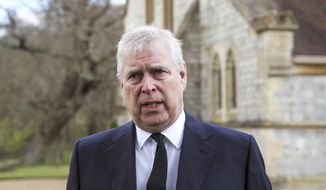 Britain&#39;s Prince Andrew during a television interview at the Royal Chapel of All Saints at Royal Lodge, Windsor, following the announcement of Prince Philip, in England, Sunday, April 11, 2021. Britain&#39;s Prince Philip, the irascible and tough-minded husband of Queen Elizabeth II who spent more than seven decades supporting his wife in a role that mostly defined his life, died on Friday. (Steve Parsons/Pool Photo via AP)