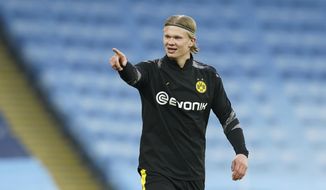 Dortmund&#39;s Erling Braut Haaland warms up before the Champions League, first leg, quarterfinal soccer match between Manchester City and Borussia Dortmund at the Etihad stadium in Manchester, Tuesday, April 6, 2021. (AP Photo/Dave Thompson)