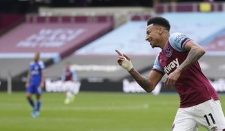 West Ham&#x27;s Jesse Lingard celebrates after scoring his side&#x27;s second goal during the English Premier League soccer match between West Ham United and Leicester City at the London Stadium in London, Sunday, April 11, 2021. (John Walton/Pool via AP)