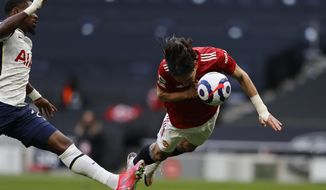 Manchester United&#39;s Edinson Cavani in action during the English Premier League soccer match between Tottenham Hotspur and Manchester United at the Tottenham Hotspur Stadium in London, Sunday, April 11, 2021. (Adrian Dennis/Pool via AP)