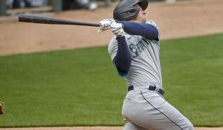 Seattle Mariners&#39; Kyle Seager hits a three-run home run against the Minnesota Twins in the ninth inning of a baseball game Sunday, April 11, 2021, in Minneapolis. (AP Photo/Bruce Kluckhohn)