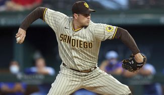 San Diego Padres pitcher Craig Stammen throws in the first inning after starting pitcher Adrian Morejon left the baseball game against the Texas Rangers on Sunday, April 11, 2021, in Arlington, Texas. (AP Photo/Richard W. Rodriguez)