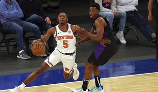 New York Knicks&#39; Immanuel Quickley (5) attempts to get past Toronto Raptors&#39; Kyle Lowry, right, who defends during an NBA basketball game at Madison Square Garden, Sunday, April 11, 2021, in New York. (Rich Schultz/Pool Photo via AP)