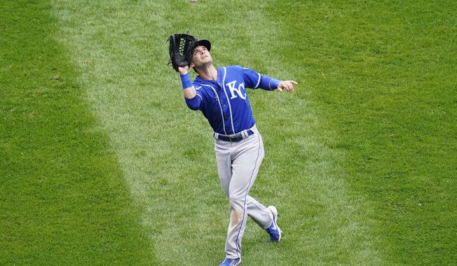 Kansas City Royals left fielder Andrew Benintendi catches a fly ball by Chicago White Sox&#x27;s Luis Robert during the fourth inning of a baseball game in Chicago, Sunday, April 11, 2021. (AP Photo/Nam Y. Huh)