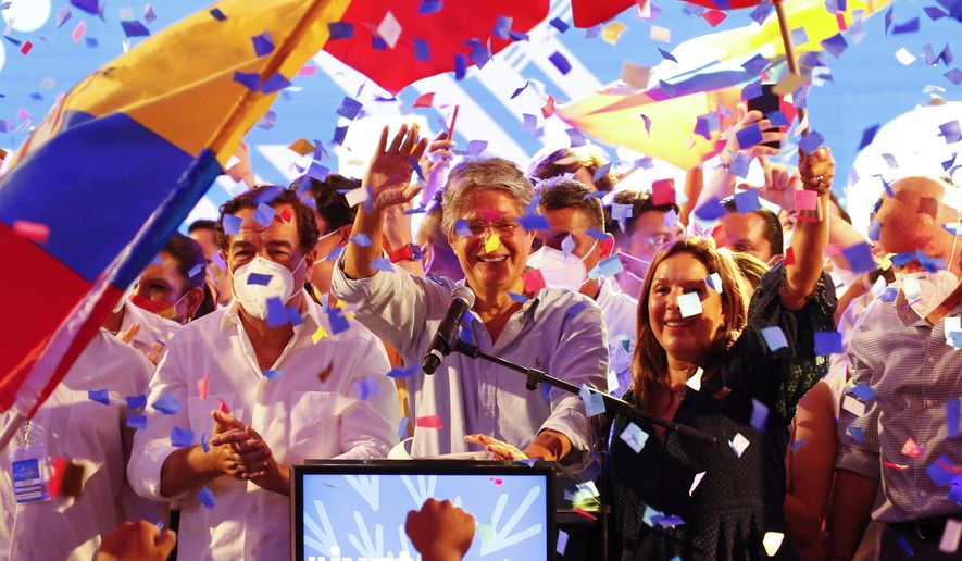 Guillermo Lasso, presidential candidate of Creating Opportunities party, CREO, celebrates after a presidential runoff election at his campaign headquarters in Guayaquil, Ecuador, Sunday, April 11, 2021. With most of the votes counted Lasso, a former banker, had a lead over economist Andres Arauz, a protege of former President Rafael Correa.(AP Photo/Angel Dejesus)