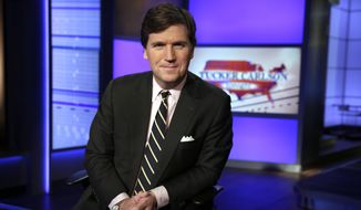 FILE - In this Thursday, March 2, 2107 file photo, Tucker Carlson, host of &amp;quot;Tucker Carlson Tonight,&amp;quot; poses for a photo in a Fox News Channel studio in New York. The Anti-Defamation League has called for Fox News to fire prime-time opinion host Tucker Carlson because he defended a white-supremacist theory that says whites are being “replaced” by people of color. In a letter to Fox News CEO Suzanne Scott on Friday, April 9, 2021the head of the ADL, Jonathan Greenblatt, said Carlson&#39;s “rhetoric was not just a dog whistle to racists — it was a bullhorn.”  (AP Photo/Richard Drew, File)