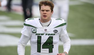 FILE - In this Sunday, Jan. 3, 2021, file photo New York Jets quarterback Sam Darnold warms up before an NFL football game against the New England Patriots in Foxborough, Mass. The New York Jets traded Darnold Monday, April 5, 2021, to the Carolina Panthers, ending a stint that was marked by a few flashes of brilliance, inconsistent play, and unfortunate injuries. (AP Photo/Stew Milne, File)