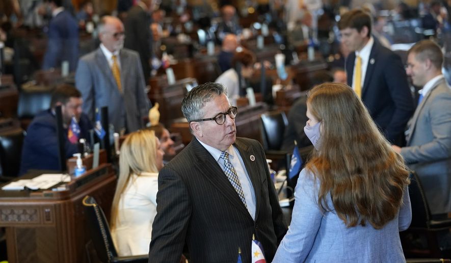 Rep. Jerome &amp;quot;Zee&amp;quot; Zeringue, R-Houma, chairman of the House Appropriations Committee, talks with a legislative staffer during the opening day of the Louisiana legislative session in Baton Rouge, La., Monday, April 12, 2021. (AP Photo/Gerald Herbert)