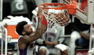 Detroit Pistons&#39; Saddiq Bey makes a dunk against the Los Angeles Clippers during the first half of an NBA basketball game Sunday, April 11, 2021, in Los Angeles. (AP Photo/Jae C. Hong)