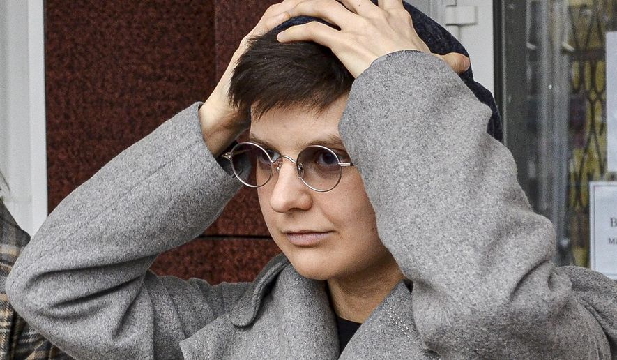 Feminist activist and artist Yulia Tsvetkova leaves after a court session in Komsomolsk-on-Amur, Russia, Monday, April 12, 2021. A Russian court on Monday opened the trial of Yulia Tsvetkova charged with disseminating pornography after she shared artwork depicting female genitalia online -- a case in line with the Kremlin’s conservative stance promoting “traditional family values.” (AP Photo/Alexander Permyakov)