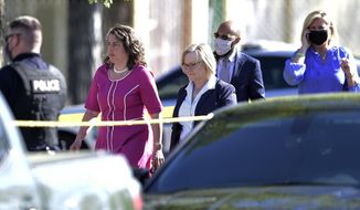 Knoxville Mayor Indya Kincannon, left, arrives at the scene of a shooting at Austin-East High School in Knoxville, Tenn. on Monday, April 12, 2021. (Calvin Mattheis/Knoxville News Sentinel via AP)