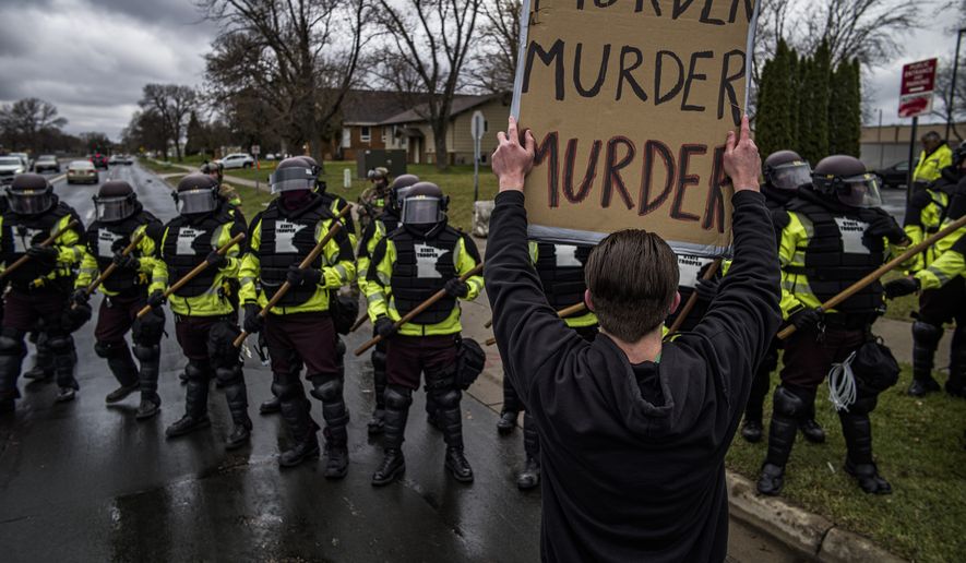 Protesters confront police over the shooting death of Daunte Wright at a rally at the Brooklyn Center Police Department in Brooklyn Center, Minn., Monday, April 12, 20121. (Richard Tsong-Taatarii/Star Tribune via AP)